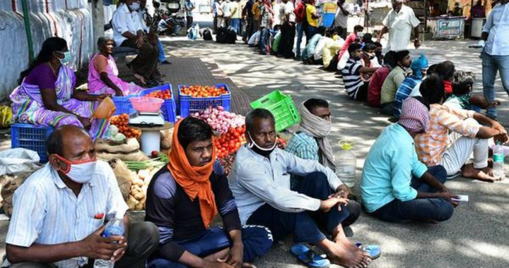 Migrant workers waiting at Uppilipalayam junction in Coimbatore city on Wednesday to register their names to go back to Bihar.
