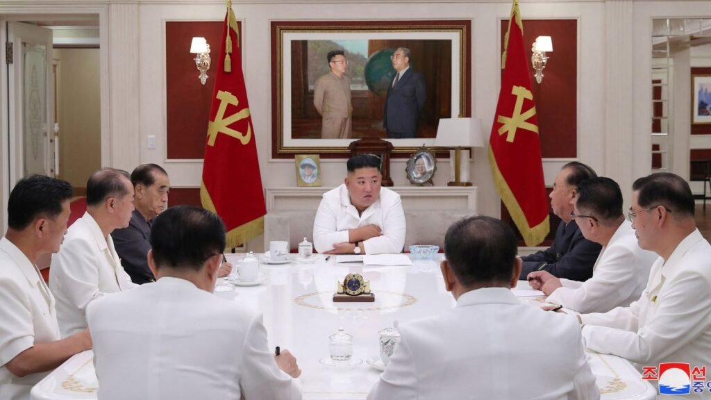 Kim Jong Un leads a meeting with officials after concerns about food supplies