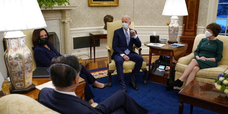 President Joe Biden meets with Sen. Susan Collins, R-Maine, right, Sen. Mitt Romney, R-Utah, to discuss a coronavirus relief package, in the Oval Office of the White House, Monday.