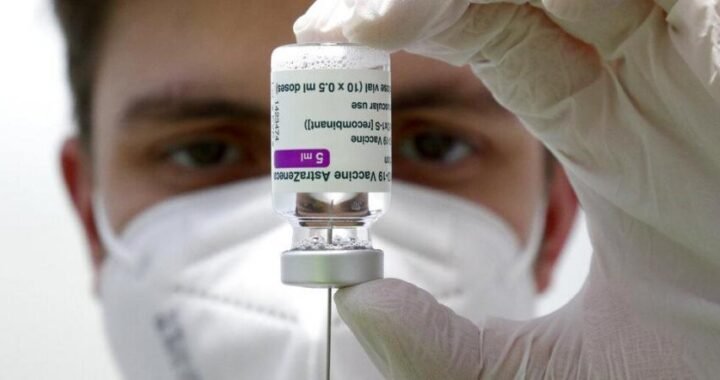 A medical staff prepares a syringe from a vial of the AstraZeneca coronavirus vaccine