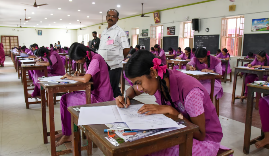 Students write Plus-Two public examination at St Philomena's girls higher secondary school in Tiruchy on Friday.